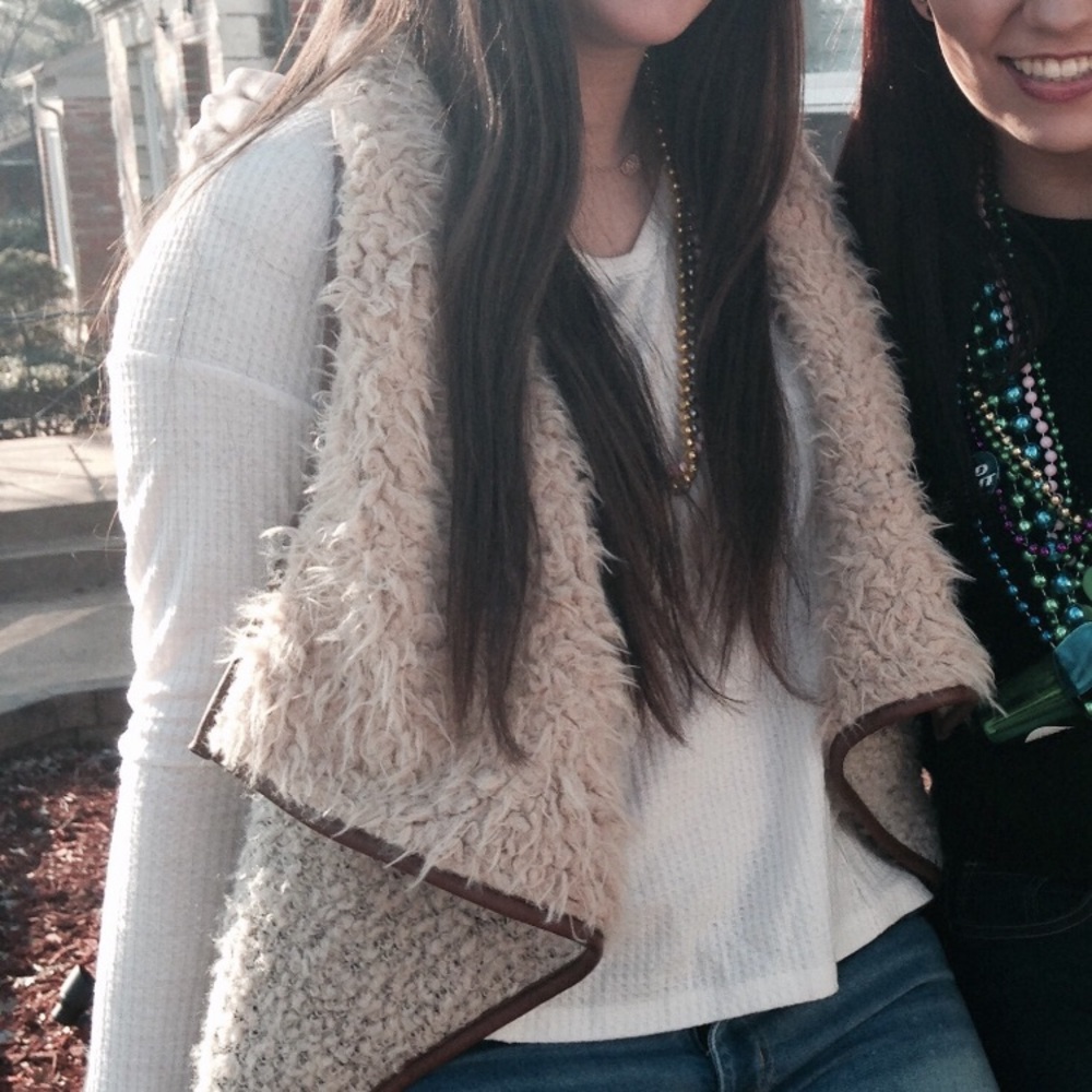 Fuzzy vest with leather detailing